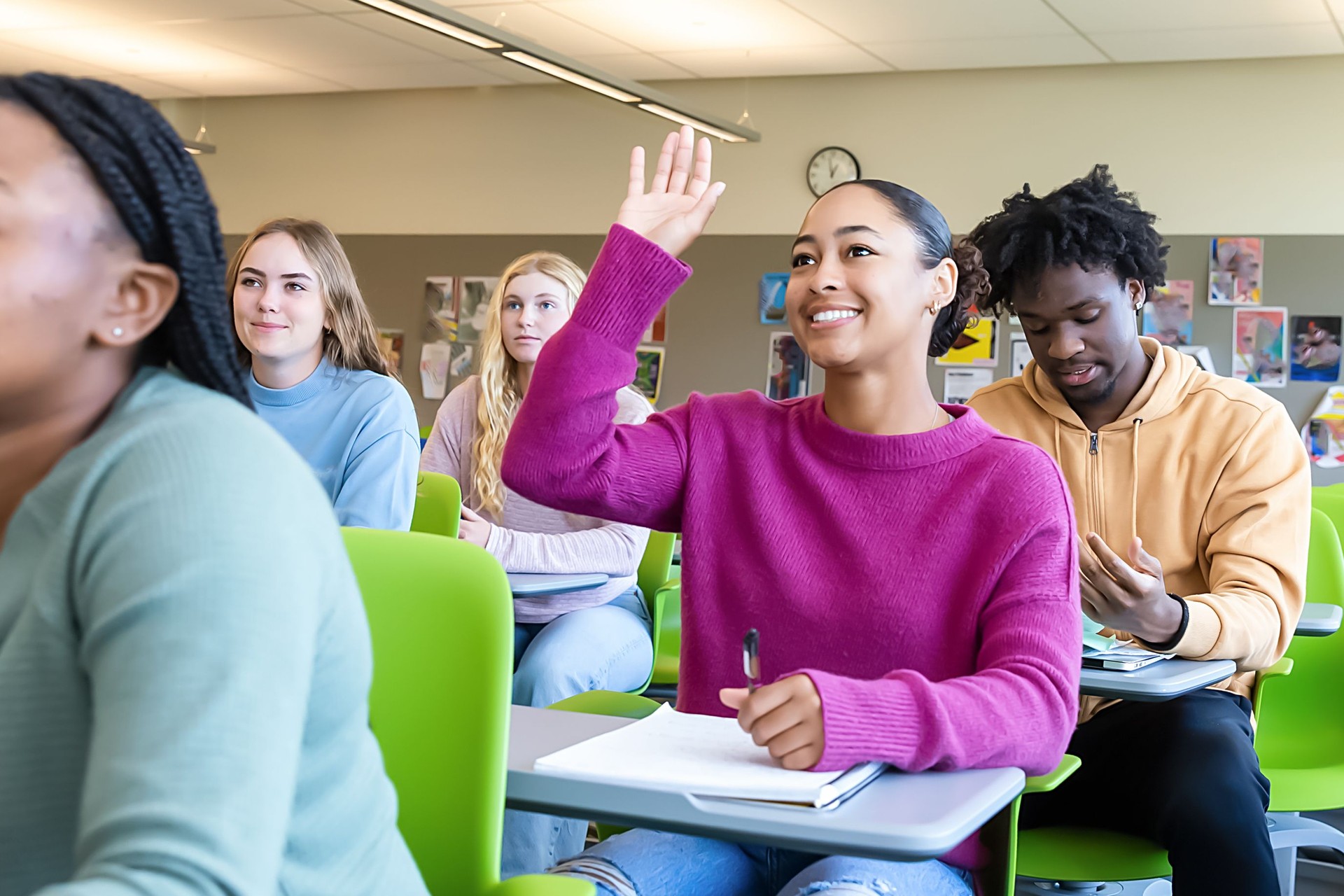 Diverse group of college students sitting in classroom